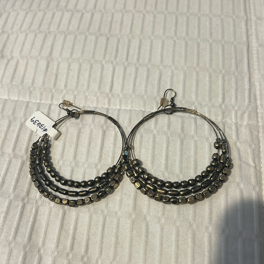 Large hoop earrings with beads on them